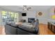 Comfortable living room with a fireplace, TV, and sliding door to the outside at 1408 Bridgeport Dr, Raleigh, NC 27615