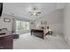 Vaulted ceiling primary bedroom with a large window letting in natural light at 1408 Bridgeport Dr, Raleigh, NC 27615