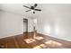 Bedroom with hardwood floors, a ceiling fan, and a closet for storage at 1701 Pinedale Dr, Raleigh, NC 27603