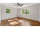 Bedroom with hardwood floors, a ceiling fan, and plenty of natural light at 1701 Pinedale Dr, Raleigh, NC 27603