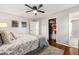 Bedroom with ceiling fan and closet, providing ample storage space at 1701 Pinedale Dr, Raleigh, NC 27603