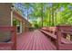 A spacious deck overlooking a treed backyard; perfect for outdoor entertaining or relaxation at 1701 Pinedale Dr, Raleigh, NC 27603