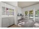 A laundry room with a side-by-side washer and dryer and access to the backyard at 1701 Pinedale Dr, Raleigh, NC 27603