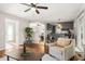 Bright living room with hardwood floors and a glimpse of dining area and kitchen at 1701 Pinedale Dr, Raleigh, NC 27603