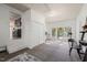 Open-concept living space with access to the backyard through glass doors and access to the kitchen at 1701 Pinedale Dr, Raleigh, NC 27603