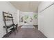 Home office features a built-in bookcase, two windows, and a closet for storage or organization at 1701 Pinedale Dr, Raleigh, NC 27603