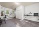Bright home office with built-in shelving, a closet, and natural light from two windows at 1701 Pinedale Dr, Raleigh, NC 27603