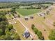 Aerial view of a home surrounded by lush greenery and neighboring properties, showcasing the community at 194 Spring Hill Church Rd, Lillington, NC 27546