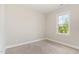 Bright bedroom with a neutral color scheme and window allowing natural light at 194 Spring Hill Church Rd, Lillington, NC 27546