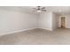 Spacious bedroom with neutral carpet, ceiling fan, and ample natural light at 194 Spring Hill Church Rd, Lillington, NC 27546