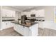 Modern kitchen featuring white cabinets, granite countertops, and stainless steel appliances at 194 Spring Hill Church Rd, Lillington, NC 27546
