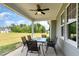 Covered patio with outdoor seating and views of the landscaped yard at 194 Spring Hill Church Rd, Lillington, NC 27546