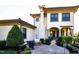 Backyard with an outdoor kitchen/grill area, beautiful landscaping, and a brick patio at 20 Al Aqua Dr, Durham, NC 27707