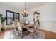 Traditional dining room featuring a round wooden table and an elegant chandelier at 20 Al Aqua Dr, Durham, NC 27707