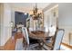 Open-concept dining room with hardwood floors, a fireplace, and natural light at 20 Al Aqua Dr, Durham, NC 27707