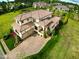 Gorgeous tile roof on this two-story stucco house with an attached two car garage at 20 Al Aqua Dr, Durham, NC 27707