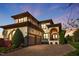Expansive home with a two-car garage and beautiful landscaping set against a picturesque sunset at 20 Al Aqua Dr, Durham, NC 27707