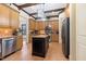Well-equipped kitchen with stainless steel appliances, granite countertops, and a center island at 20 Al Aqua Dr, Durham, NC 27707