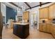 Bright eat-in kitchen with a dark wood central island, adjacent to breakfast room at 20 Al Aqua Dr, Durham, NC 27707