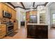 Modern kitchen with stainless appliances and ample storage, plus a view to the laundry room at 20 Al Aqua Dr, Durham, NC 27707