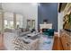 Bright living room with high ceilings, fireplace, and stylish, comfortable seating at 20 Al Aqua Dr, Durham, NC 27707
