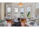 Inviting sitting room with hardwood floors, plenty of natural light, and views to the yard at 20 Al Aqua Dr, Durham, NC 27707