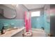 Charming bathroom with turquoise tile, and a decorative pink curtain creating a refreshing and inviting space at 2006 Waters Dr, Raleigh, NC 27610