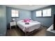 Inviting bedroom with a metal bed frame, and wood floors providing a bright space with modern comforts at 2006 Waters Dr, Raleigh, NC 27610