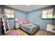 Bright bedroom with wood floors, and creative decor, offers a stylish and welcoming space at 2006 Waters Dr, Raleigh, NC 27610