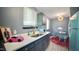 Bright kitchen showcases custom cabinets, quartz countertops, and views of the adjacent dining area at 2006 Waters Dr, Raleigh, NC 27610