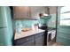 Stylish kitchen with modern appliances, custom cabinetry, and a view of the adjacent breakfast nook at 2006 Waters Dr, Raleigh, NC 27610