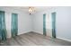 Bright bedroom with light-gray walls, modern flooring, a ceiling fan, and well-lit windows at 206 Lane Of Tristram, Garner, NC 27529