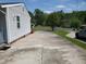 Long driveway leading to the side of the house, offering ample parking and easy access at 206 Lane Of Tristram, Garner, NC 27529