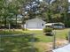 A detached garage provides ample parking and storage space, complemented by a fenced yard at 206 Lane Of Tristram, Garner, NC 27529