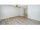 Spacious living room featuring wood-look floors and neutral paint, with a ceiling fan at 206 Lane Of Tristram, Garner, NC 27529