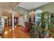 Elegant dining room with hardwood floors, a chandelier, and a large arched window at 208 E Harrington Ave, Broadway, NC 27505