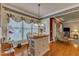 Bright dining nook with a kitchen island, pendant lighting and views to the living room at 208 E Harrington Ave, Broadway, NC 27505