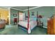 Comfortable bedroom featuring a four-poster bed with warm lighting and classic decor at 208 E Harrington Ave, Broadway, NC 27505