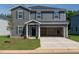Charming two-story home features a well-kept lawn and an attached two-car garage at 2239 Cherry Creek Rd, Haw River, NC 27258