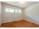 Bedroom featuring hardwood floors and windows at 2343 Derby Dr, Raleigh, NC 27610