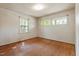 Bedroom featuring hardwood floors and plenty of natural light at 2343 Derby Dr, Raleigh, NC 27610