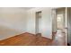 This bedroom features hardwood floors, a closet, and an en-suite bathroom at 2343 Derby Dr, Raleigh, NC 27610