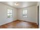 Bright bedroom featuring hardwood floors and natural light at 2343 Derby Dr, Raleigh, NC 27610