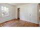 Bedroom featuring hardwood floors, closet and natural light at 2343 Derby Dr, Raleigh, NC 27610