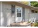 Close up of home's front door with peeling paint and chipping door frame at 2343 Derby Dr, Raleigh, NC 27610