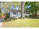 Lovely home with stone accents, green lawn, and mature trees at 2343 Derby Dr, Raleigh, NC 27610