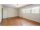 Living room featuring hardwood floors and lots of natural light at 2343 Derby Dr, Raleigh, NC 27610