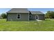 Back exterior of a home on a large lawn at 261 Phil Jack Rd, Dunn, NC 28334