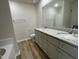 A bathroom with double sink vanity, granite countertop and wood look floors at 261 Phil Jack Rd, Dunn, NC 28334