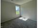 Bedroom with plush carpeting and a window providing lots of natural light at 261 Phil Jack Rd, Dunn, NC 28334